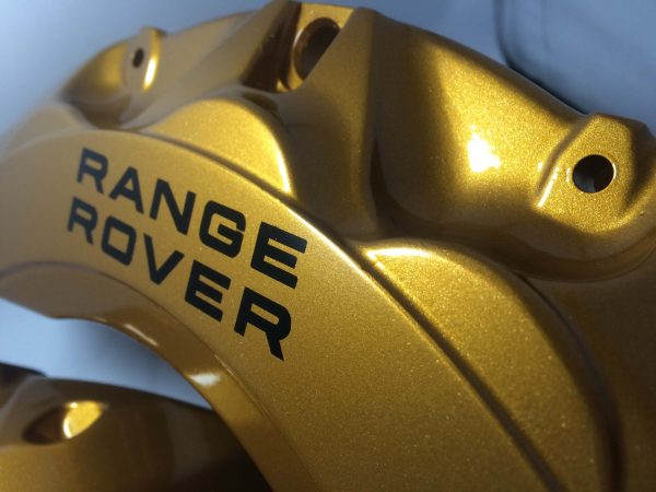 Gold caliper with black Range Rover brake caliper decals